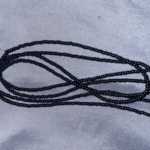 All black seed beads , this product is a waist bead